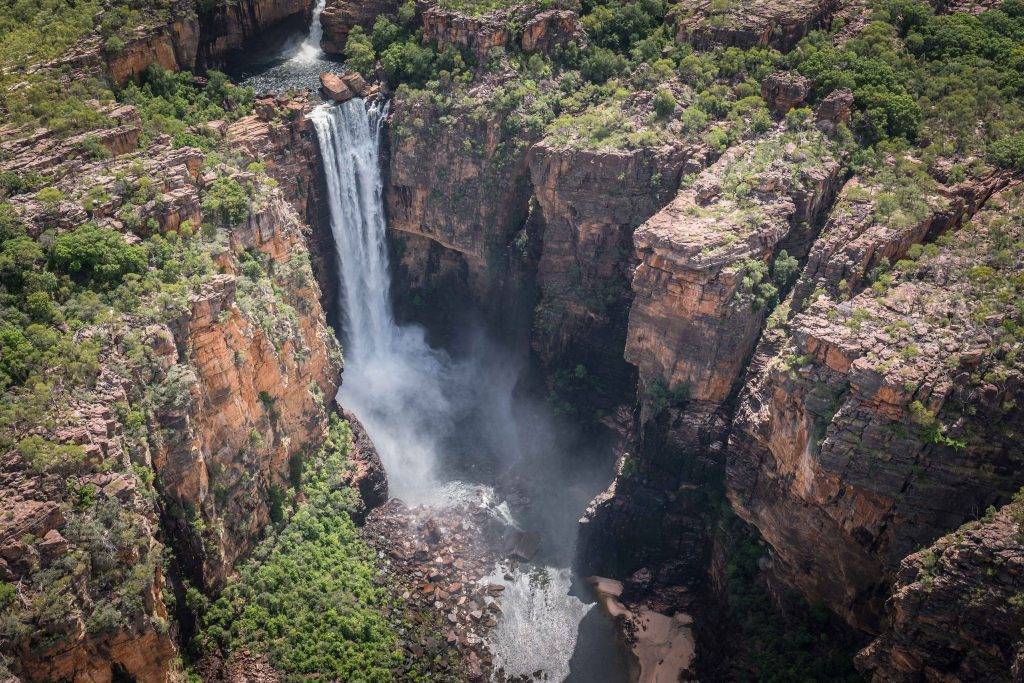 "Majestic Jim Jim Falls in Kakadu National Park, accessible only by 4WD or helicopter."