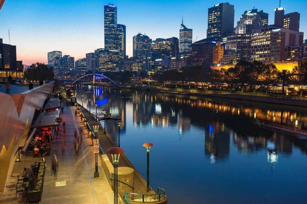 "Melbourne's Southbank illuminated at night, showcasing the city's lively and picturesque waterfront."