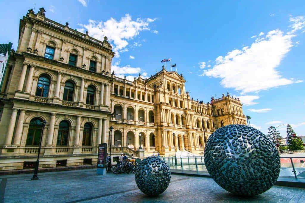 "The historic Brisbane Treasury Casino, dating back to 1900, set against the cityscape, reflecting Brisbane's rich architectural heritage."